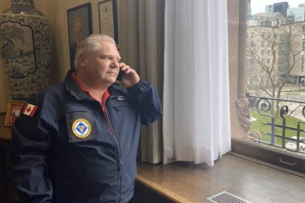 Doug Ford pretending to call someone from Queen's Park, gazing longingly out the window.